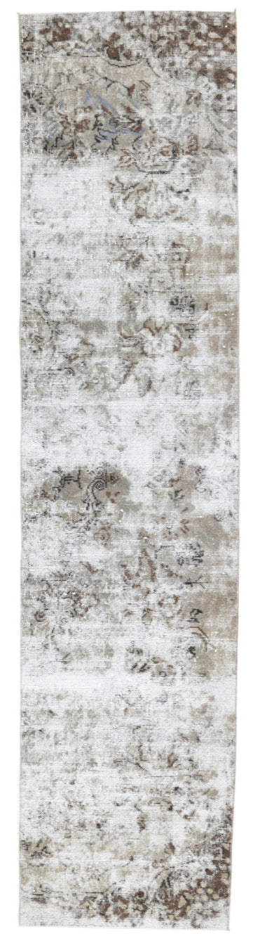 Long, narrow rug with a textured pattern in neutral colors.