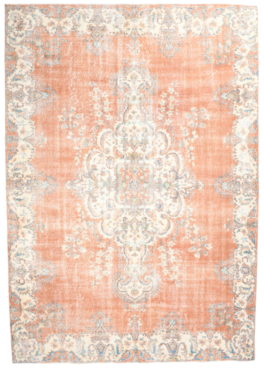 Decorative rug with a floral pattern on a plain background