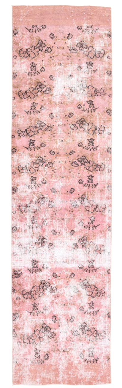 Floral patterned fabric swatch on a pink background