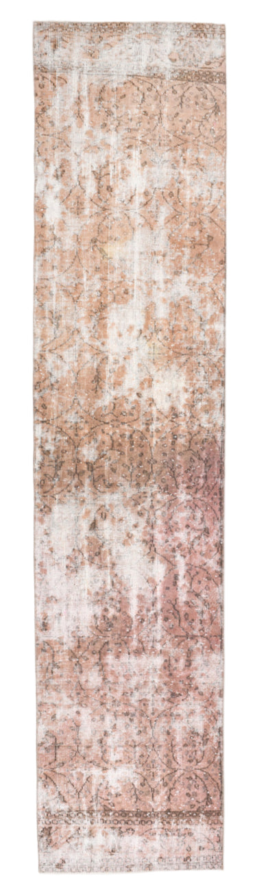 Long rectangular rug with a textured pattern in shades of brown and beige.