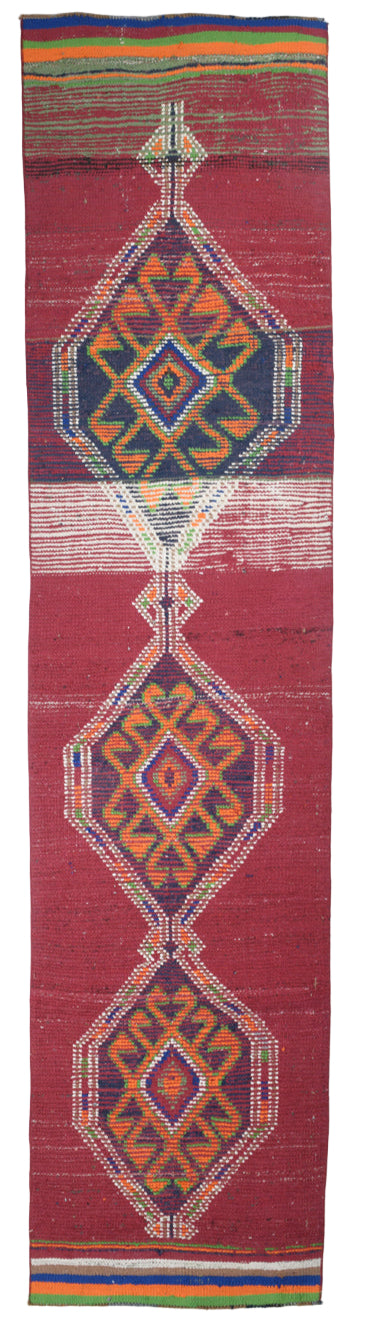 Textile with geometric patterns on a red background