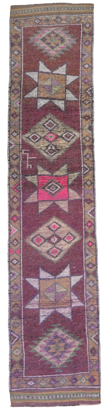 Decorative rug with geometric patterns on a plain background