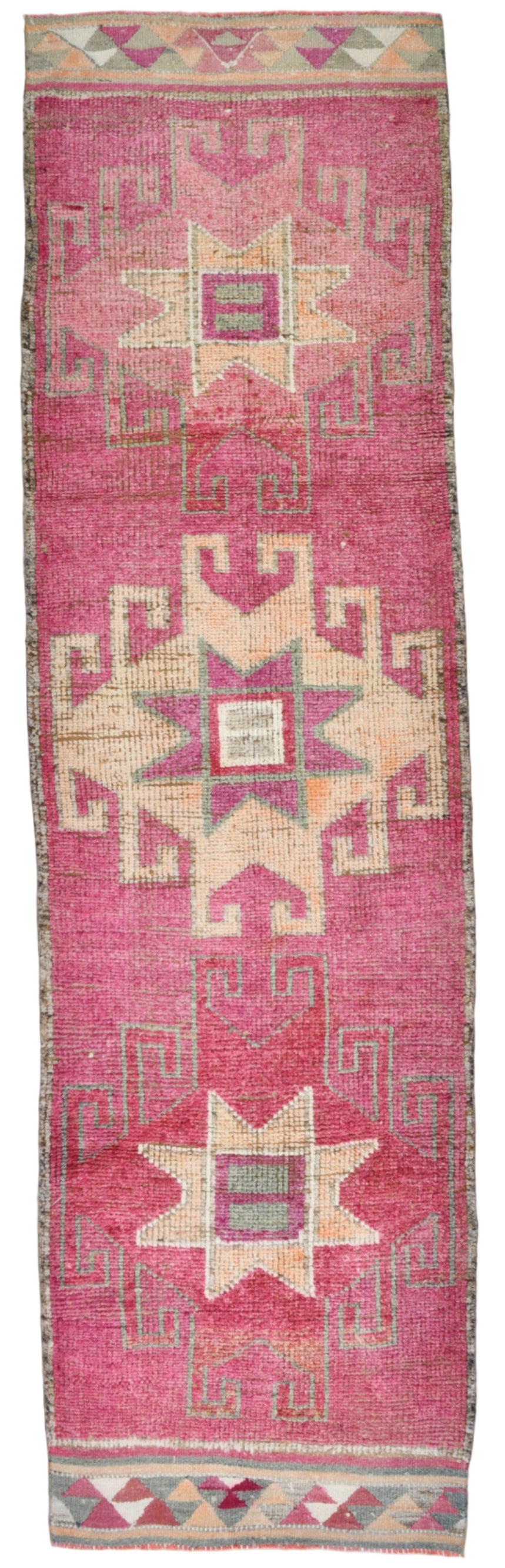 Pink and beige geometric patterned rug