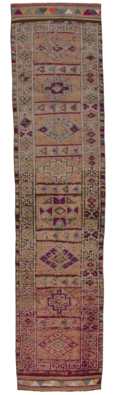 Long, narrow fabric with intricate patterns and colors on a white background