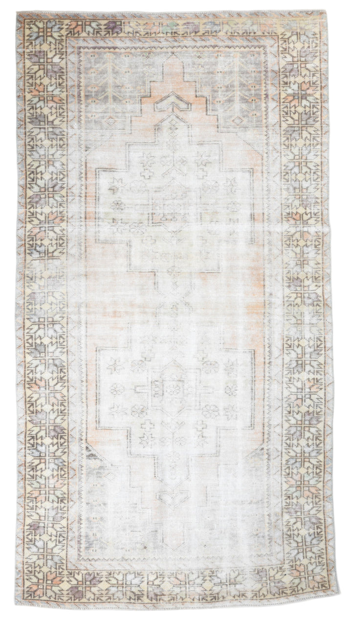 Rectangular rug with intricate patterns on a plain background
