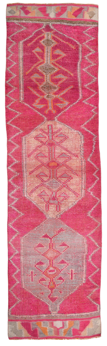 Textile with geometric pattern on a pink background