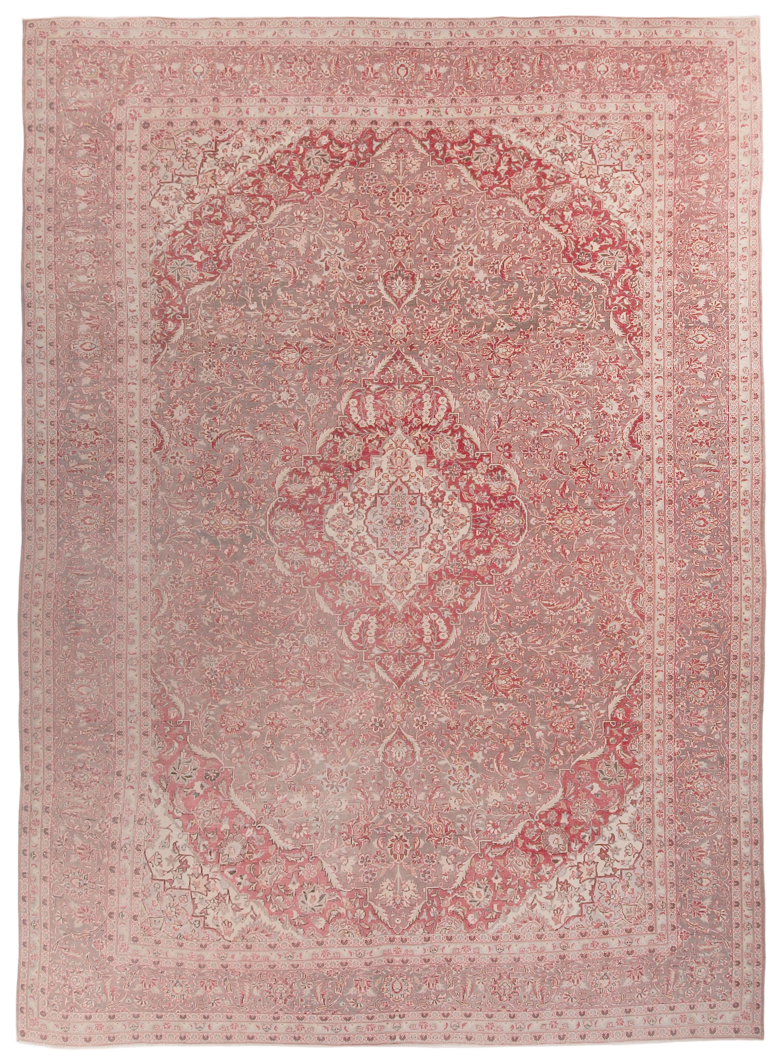 Decorative oversize persian area rug with intricate pattern on a plain background 