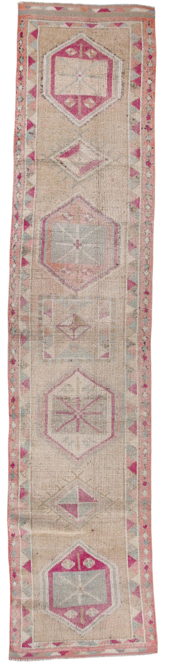 Long narrow rug with geometric pattern on beige background