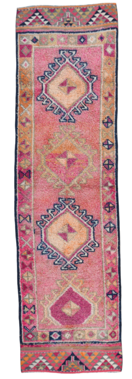 Decorative rug with geometric patterns on a plain background