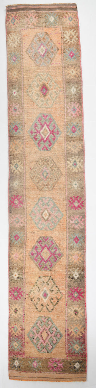 Decorative rug with geometric patterns on a beige background