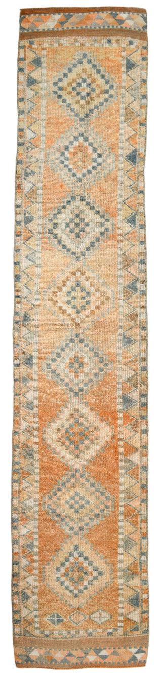 Patterned rug with geometric design on a plain background