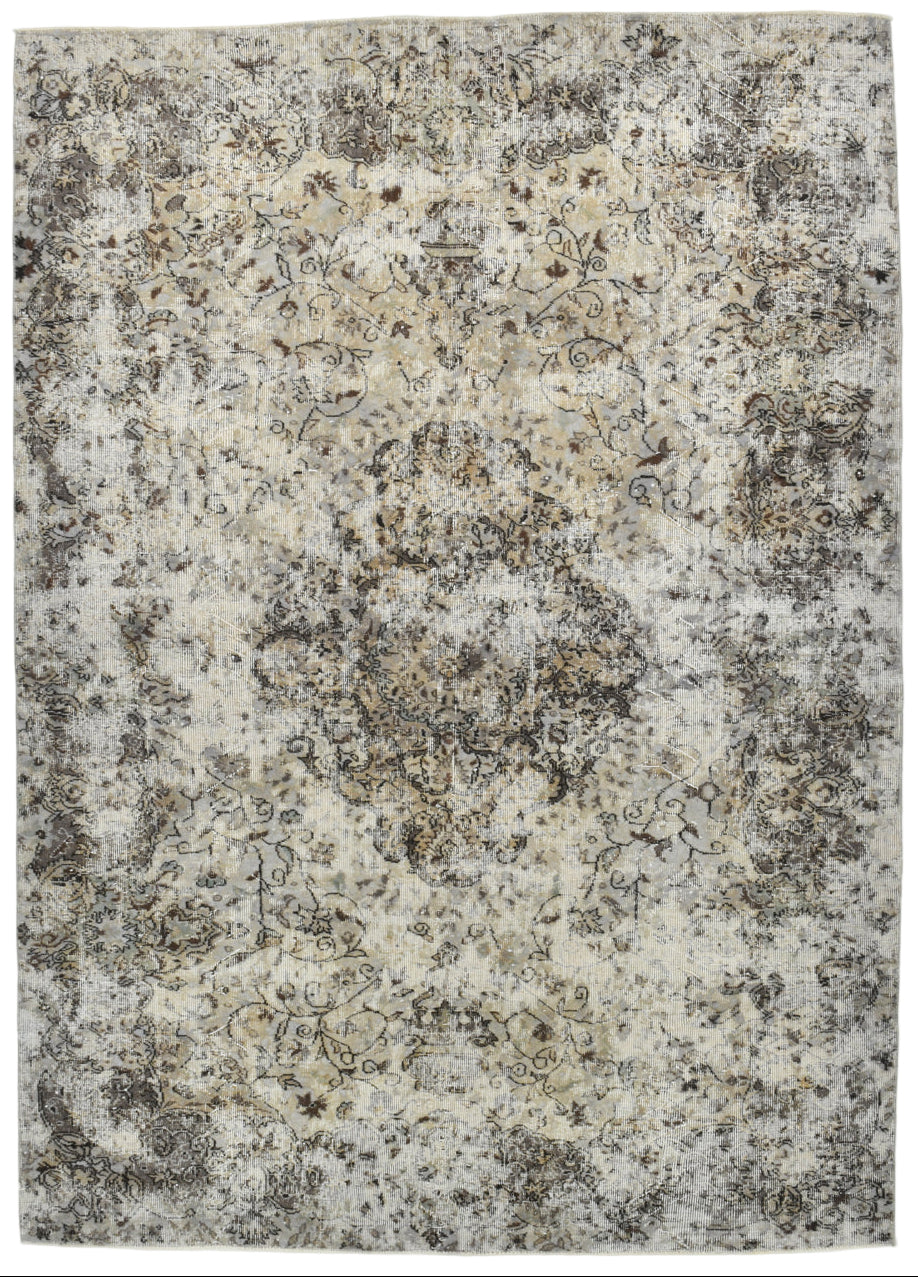 Patterned rug with beige, brown, and gray colors on a white background