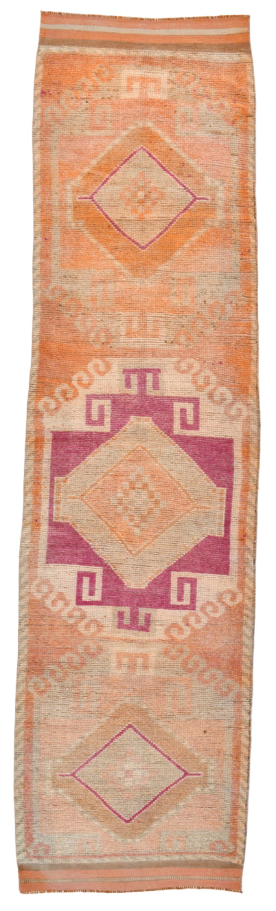 Woven textile with geometric patterns on a white background
