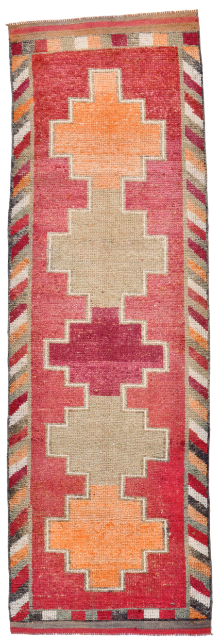 Decorative rug with geometric pattern on a plain background