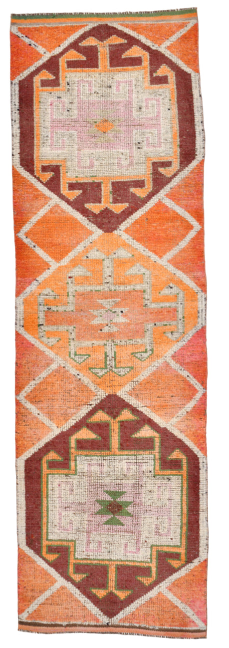 Decorative rug with geometric patterns on a vertical display