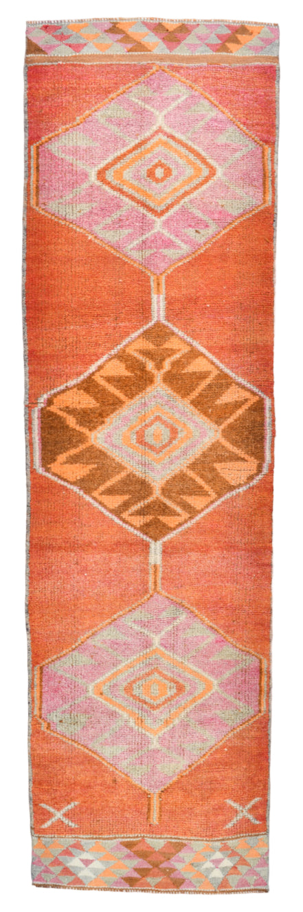Decorative rug with geometric pattern on a plain background