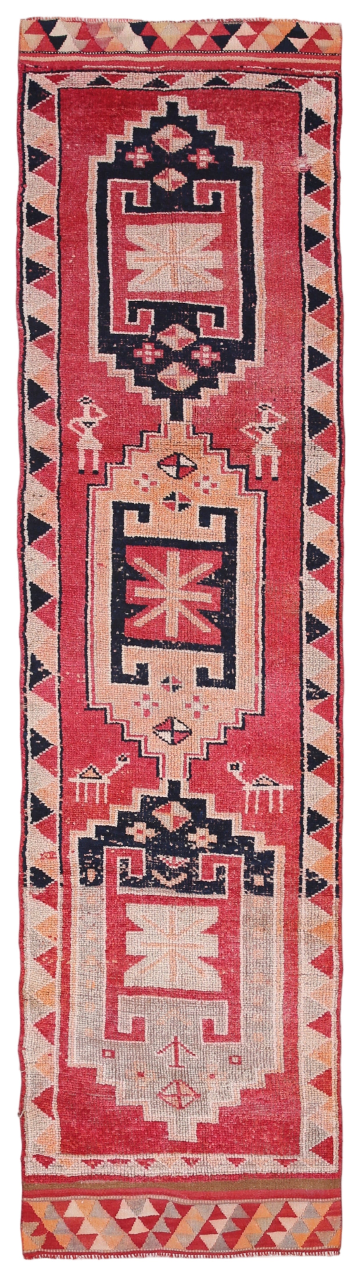 Traditional patterned rug with geometric design on a red background