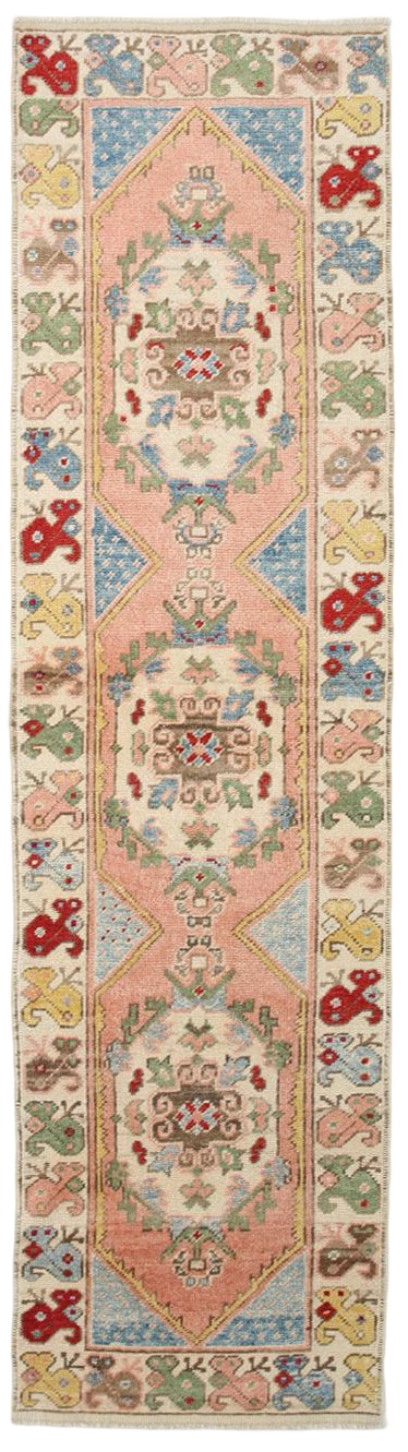 Decorative rug with intricate patterns and colors on a white background