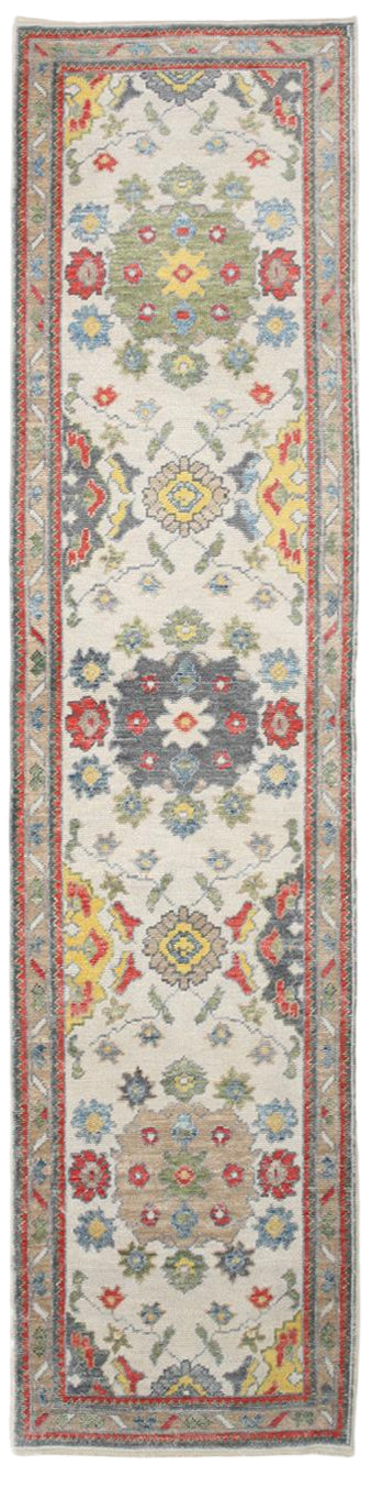 Decorative runner rug with floral patterns on a white background