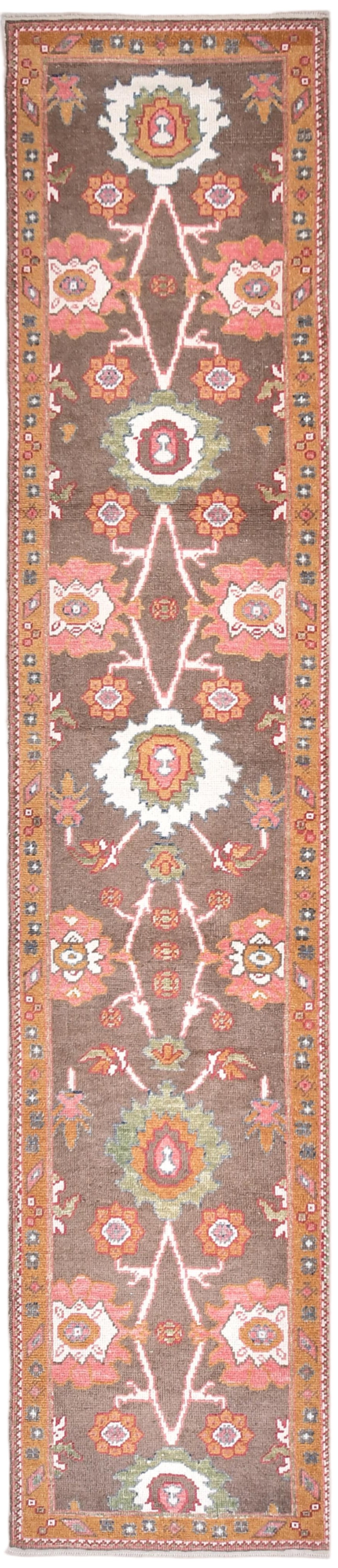 Decorative rug with intricate patterns on a brown background
