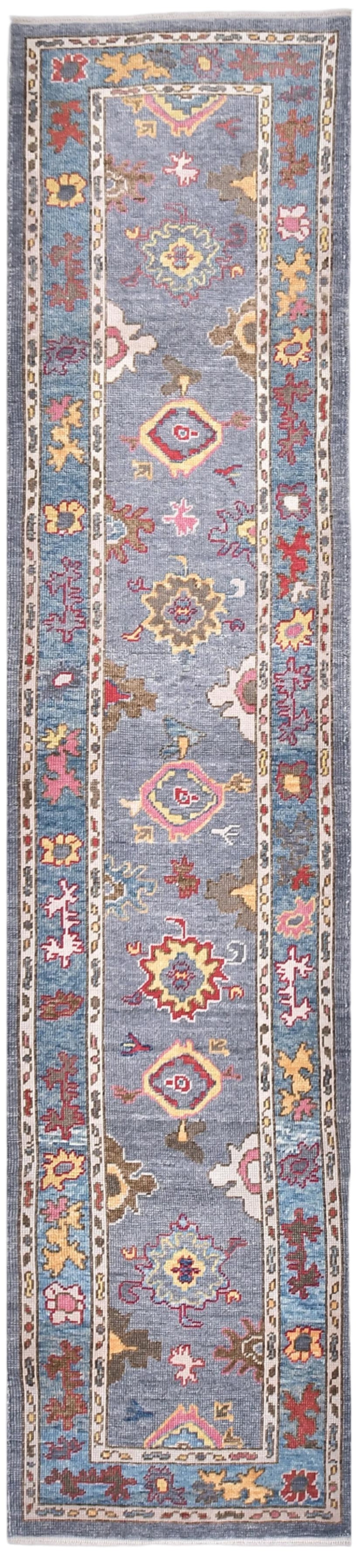 Decorative rug with geometric pattern on a blue background
