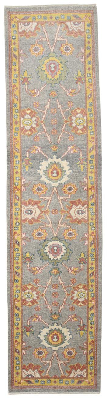 Decorative runner rug with geometric pattern on a gray background