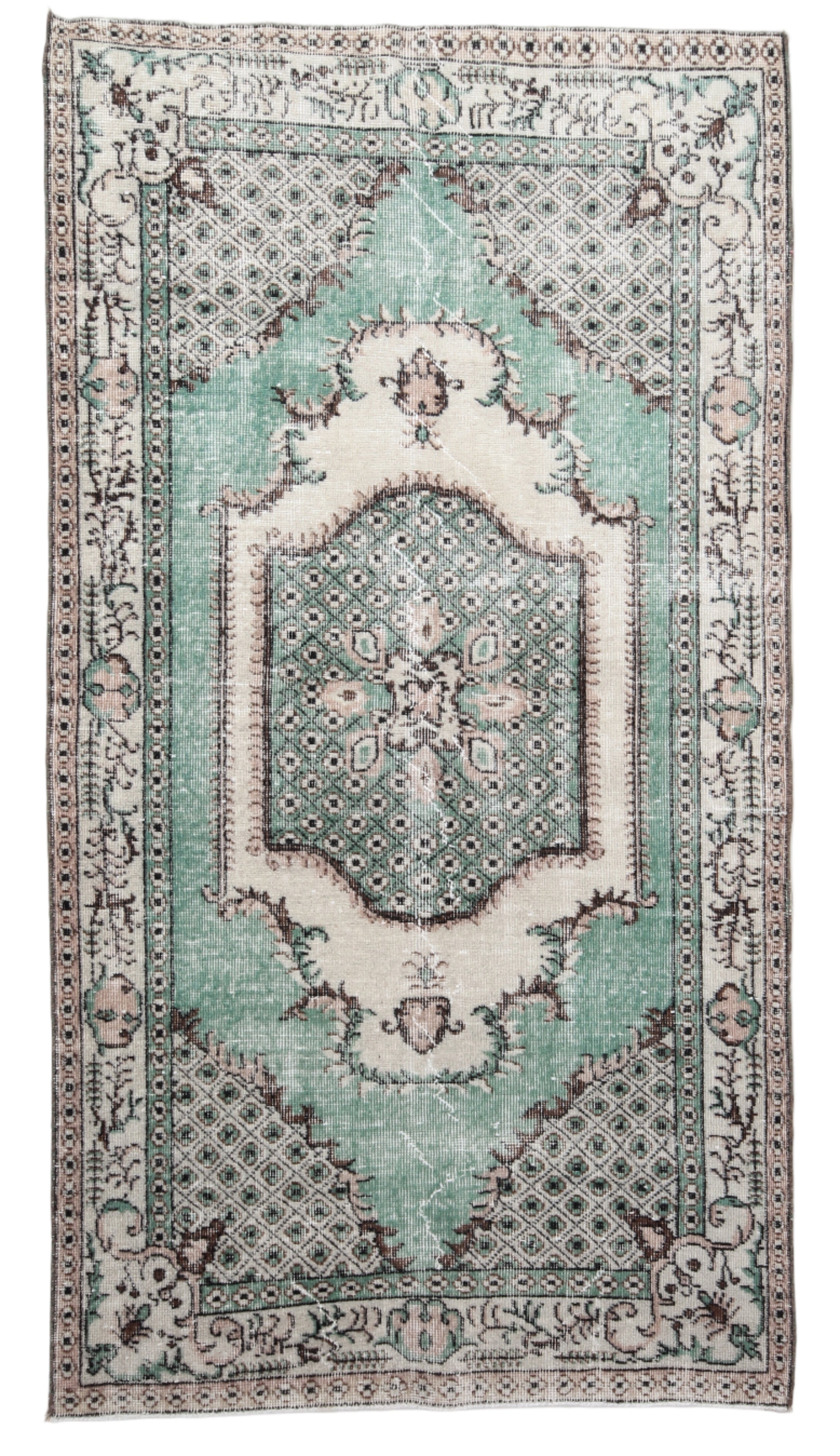 Decorative rug with intricate patterns and a light blue center on a white background