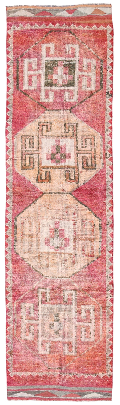 Traditional patterned rug with geometric design on a red background