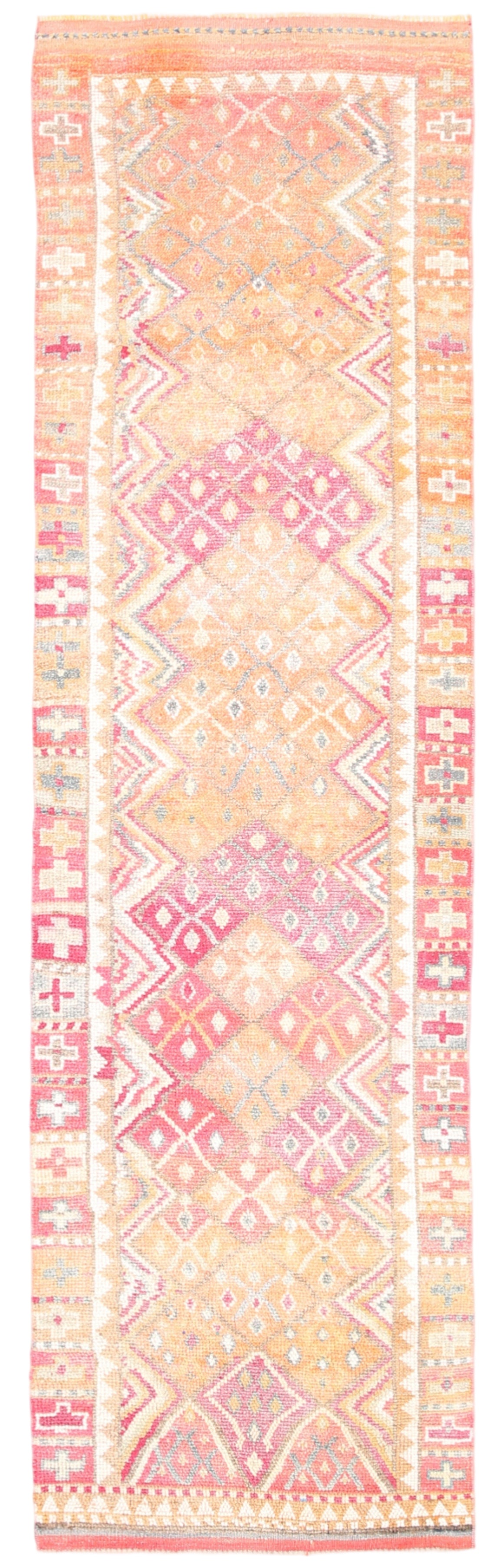 Patterned rug with geometric design in pastel colors