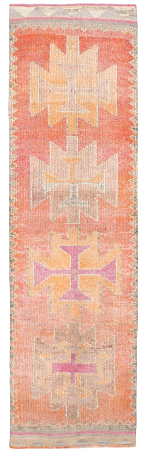 Woven rug with geometric pattern on a plain background