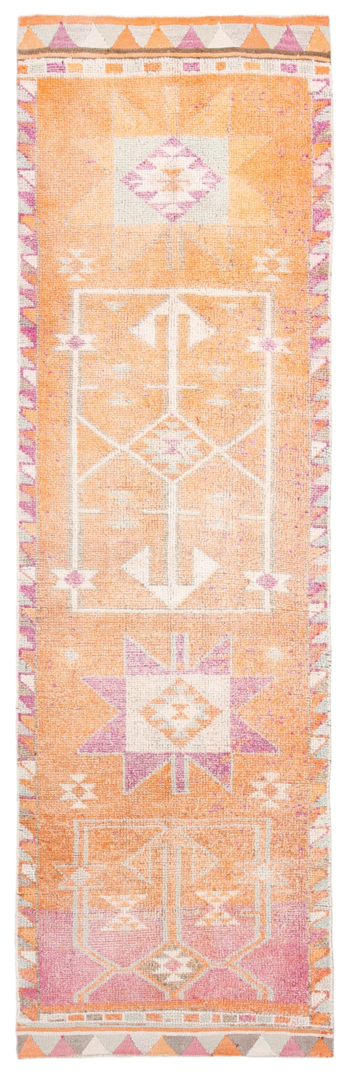 Decorative rug with geometric pattern on a peach background