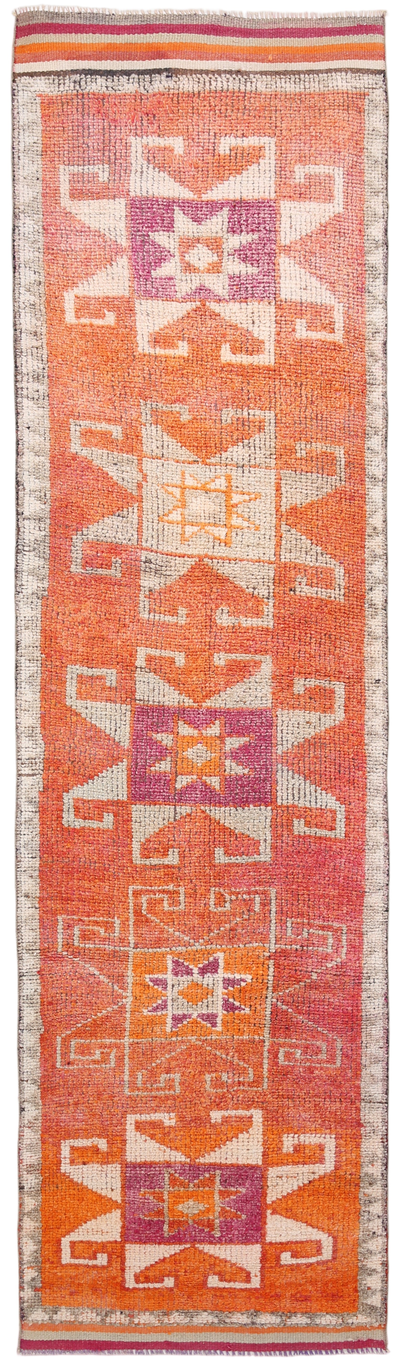 Woven runner with geometric pattern on a plain background