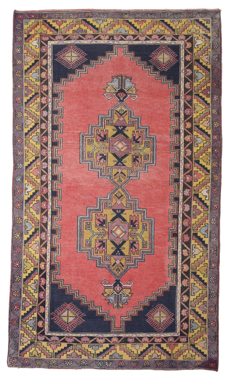 Traditional rug with geometric pattern on a white background