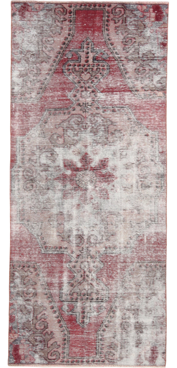 Patterned rug with red and beige colors on a white background
