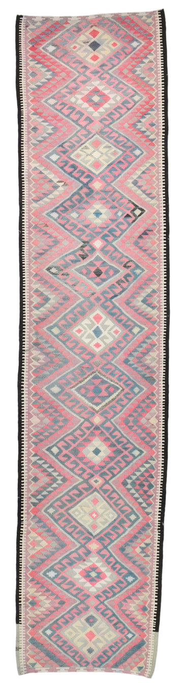 Woven textile with geometric pattern on a plain background