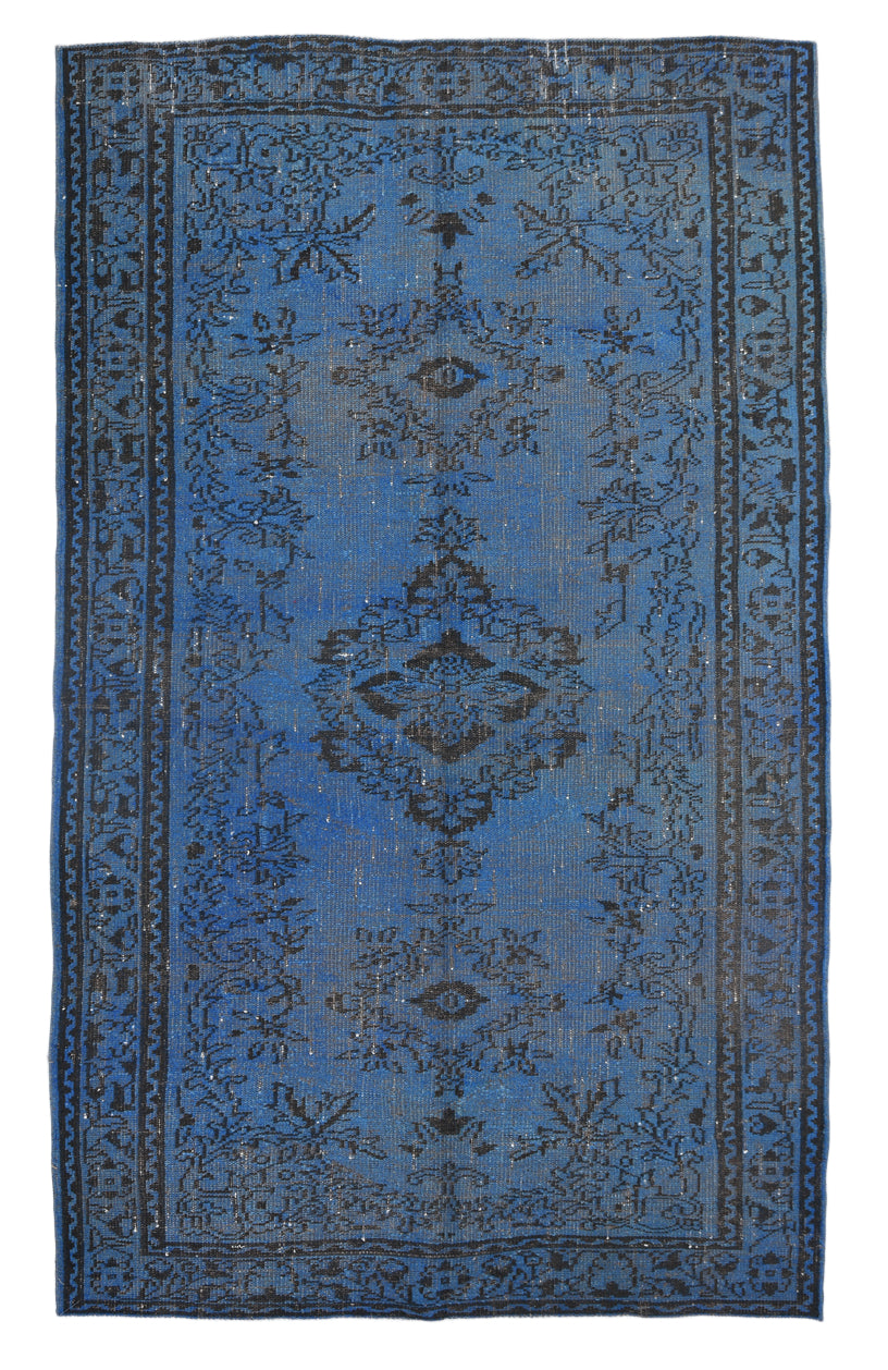 Blue patterned rug on a white background