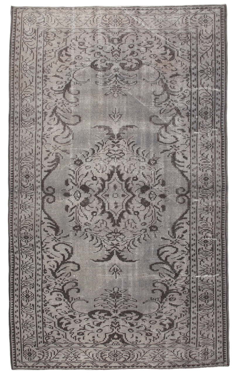 Decorative rug with intricate pattern on a plain background