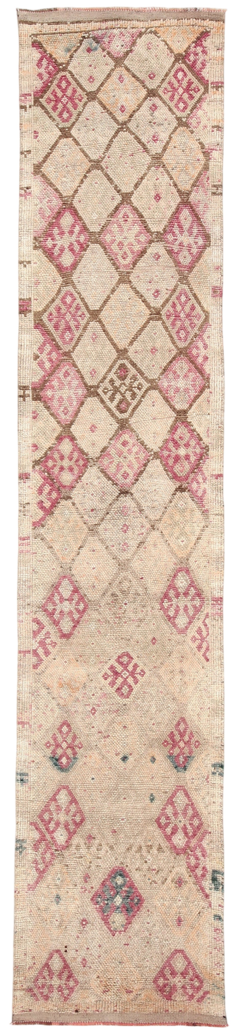 Long, narrow rug with geometric pattern on a white background