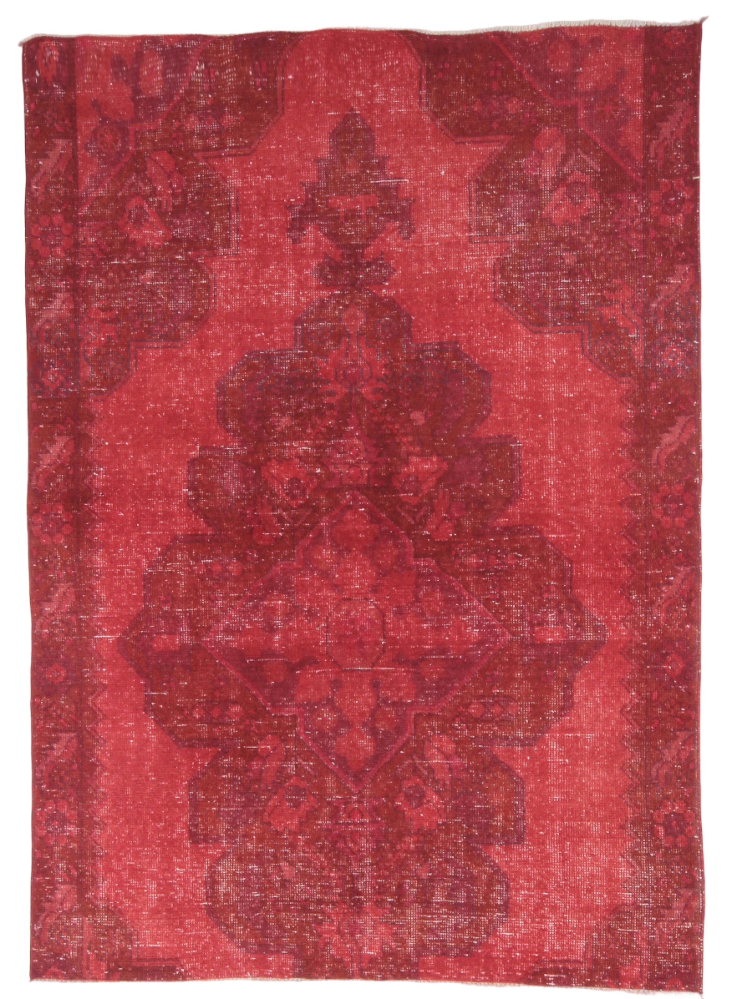 Red patterned rug with a white background