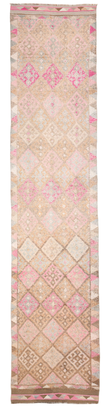 Decorative pink and beige patterned rug
