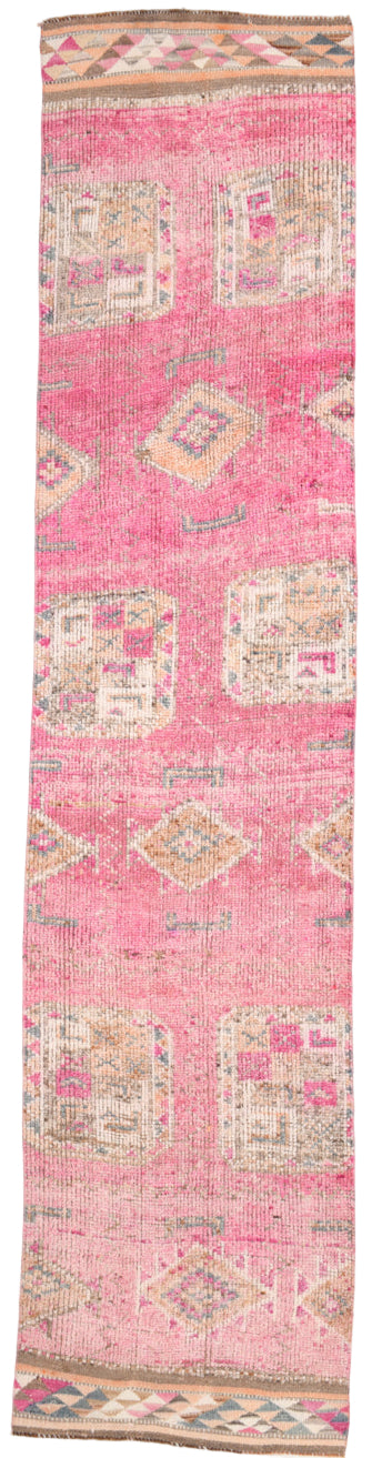 Pink runner rug with geometric patterns