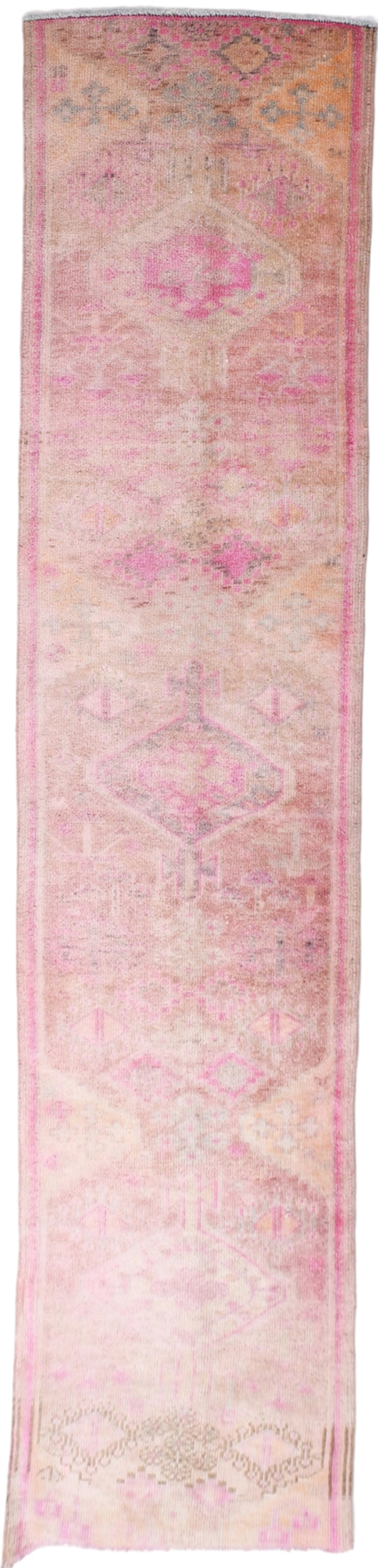 Long, narrow pink and purple patterned rug