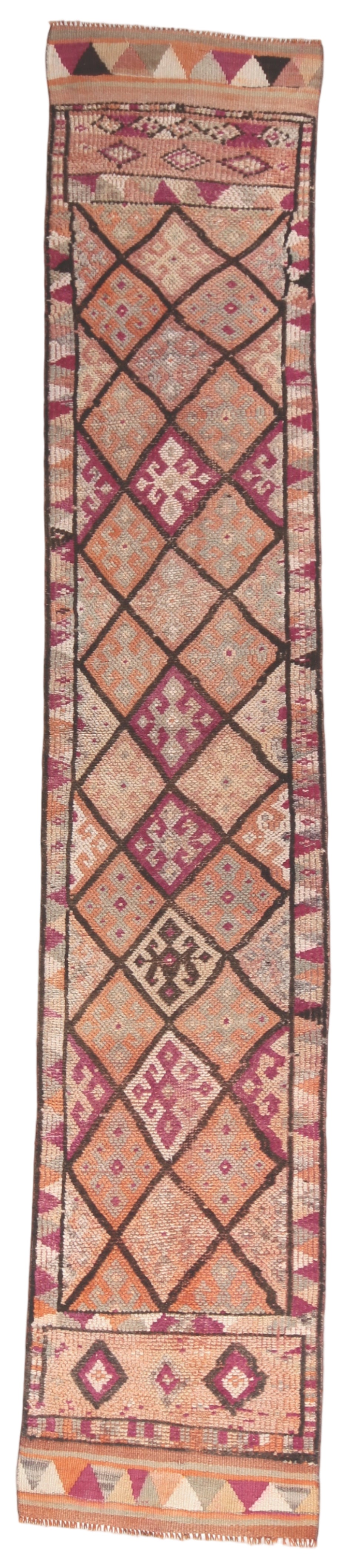 Long, narrow patterned rug with geometric design on a plain background