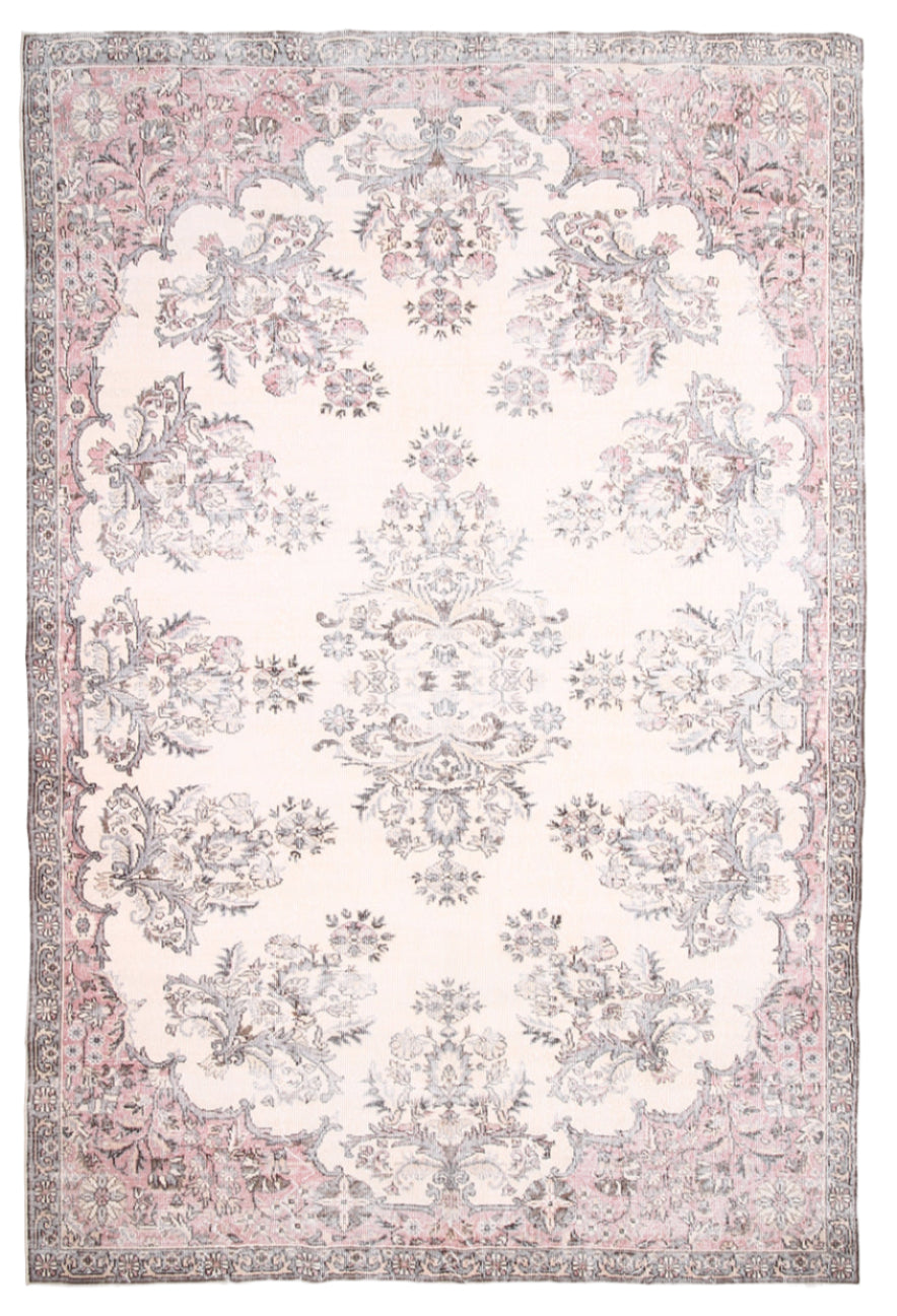 Decorative rug with floral pattern on a plain background