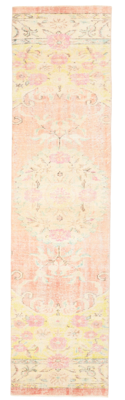 Long, narrow rug with a floral pattern on a plain background