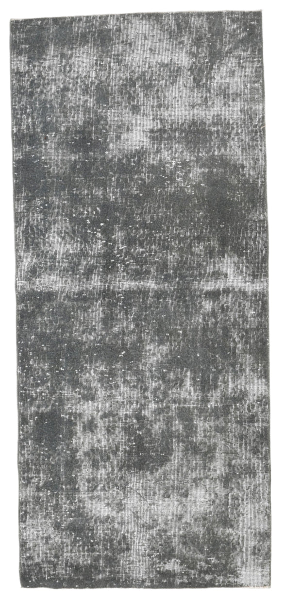 Rectangular rug with a textured pattern on a plain background