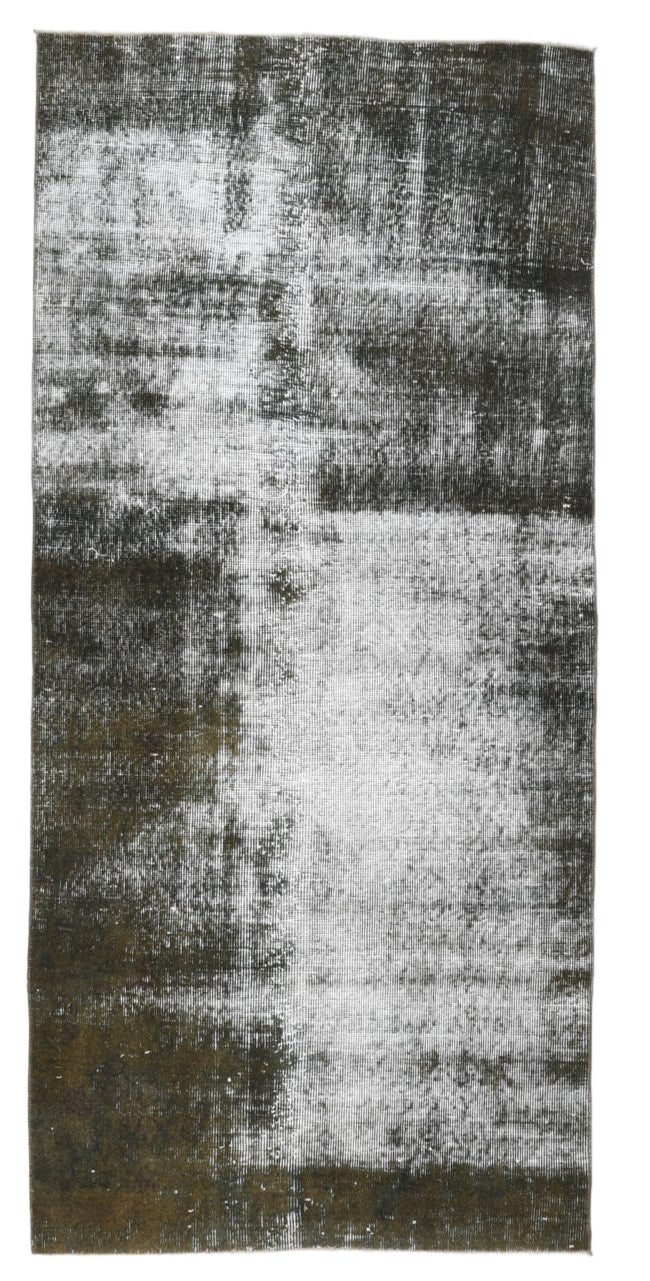 Textured area rug with abstract pattern on a white background