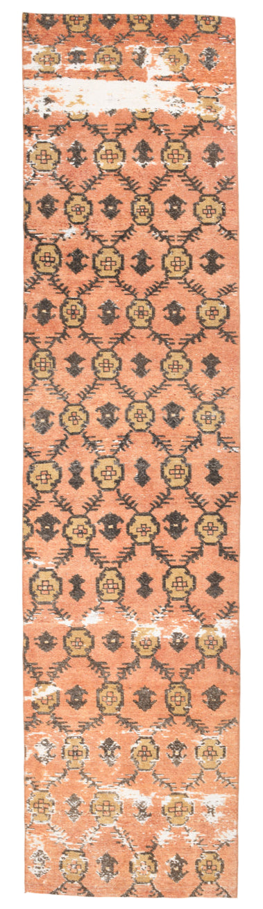 Patterned rug with geometric design on a peach background