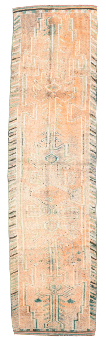 Long rectangular rug with geometric pattern on a white background