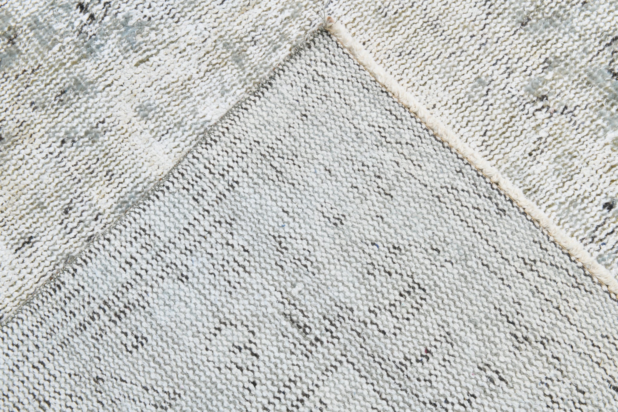 Close-up of a textured stone surface with a diamond pattern